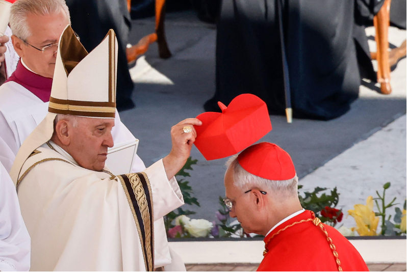 Pope Francis puts the red biretta on the head of new cardinal Robert Francis Prevost during a consistory in St. Peter Square at the Vatican, September 30, 2023. Contributor: Riccardo De Luca - Update Images / Alamy Stock PhotoImage ID: 2WBR2T0
