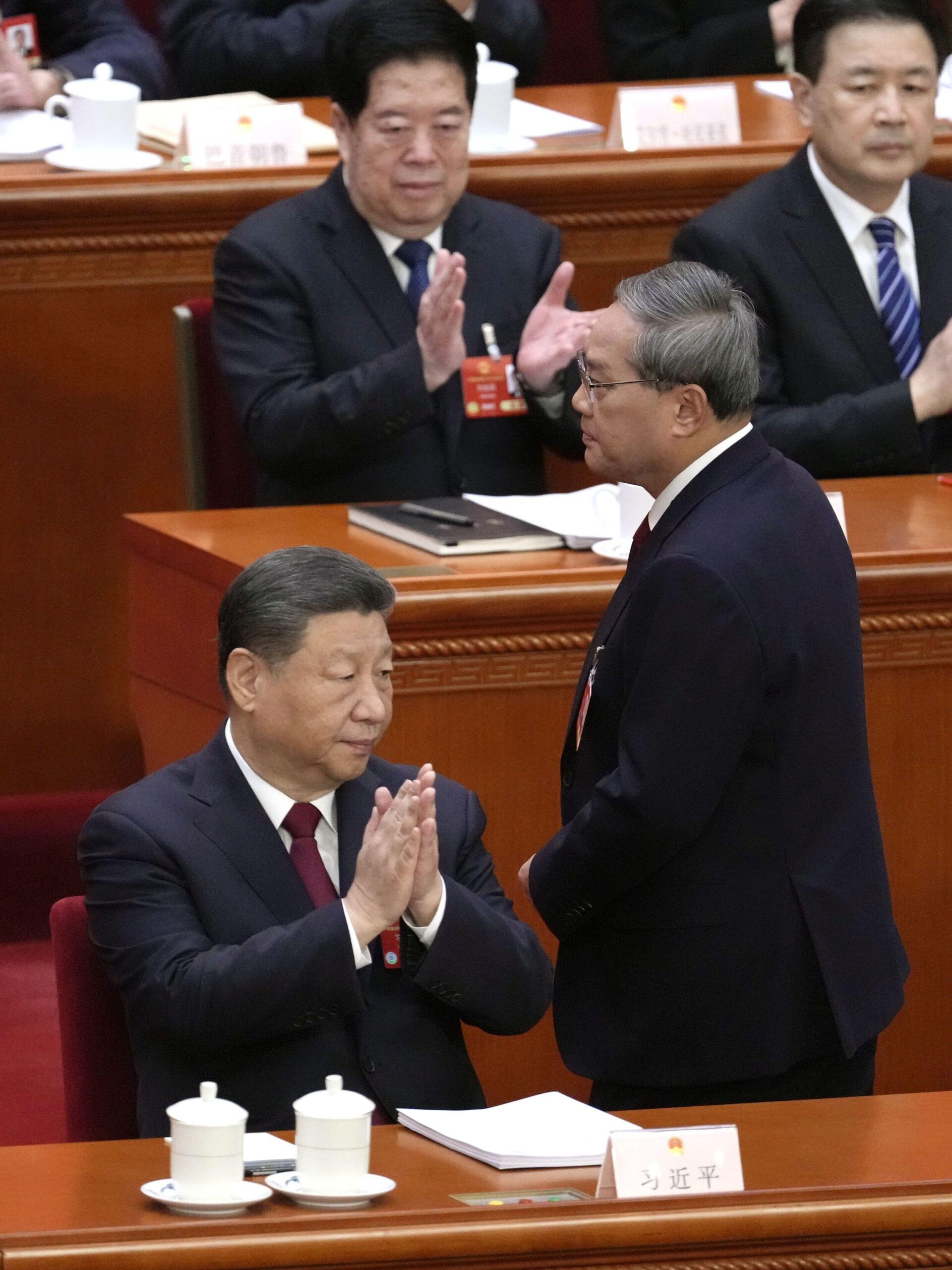 Chinese Premier Li Qiang (R, front) heads to the podium to speak at the opening ceremony of the weeklong National Peoples Congress at the Great Hall of the People in Beijing on March 5, 2025, as President Xi Jinping (L, front) claps. (Kyodo)==Kyodo Photo via Credit: Newscom/Alamy Live News Contributor: Newscom / Alamy Stock PhotoImage ID: 3A0YNA5