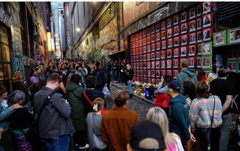 People gather during the Mothers Day Eve memorial vigil at the She Matters Mural in Melbourne. A memorial vigil takes place on the eve of Mothers Day at the She Matters Mural in Hosier Lane, Melbourne. The event features speeches, the reading of names of women and children who lose their lives to violence in 2024, and the laying of flowers and lighting of electric candles by attendees. Held in tribute to those unable to celebrate with their families, the vigil serves as a poignant reminder of the ongoing impact of gender-based violence in Australia. (Photo by Ye Myo Khant/SOPA Images/Sipa. Contributor: Sipa USA / Alamy Stock Photo Image ID: 3B9MP2K